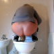 An anonymous blonde girl takes a pis and shit into a toilet while squatting above it. A close-up view of the poop is shown afterwards.